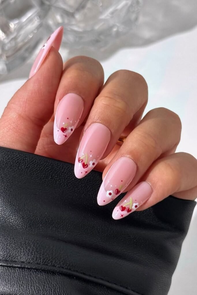 Inspired by the delicate beauty of cherry blossoms, this manicure features soft pink tones with floral cherry accents. A perfect choice for spring, weddings, or anyone who loves a soft, feminine look. Pair it with glossy finishes for extra elegance!