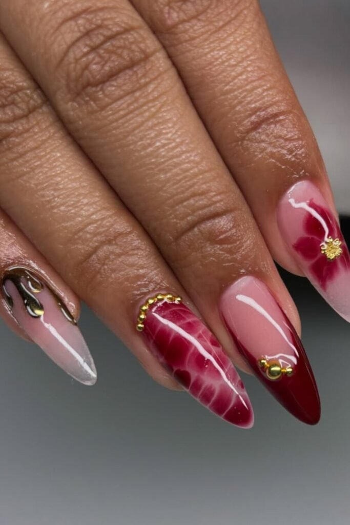 For the trendsetters, croc print cherry nails combine the best of both worlds—textured croc skin prints with a deep cherry red tips and golden glittery accents. It’s a statement nail look that’s edgy, high-fashion, and totally Instagram-worthy.