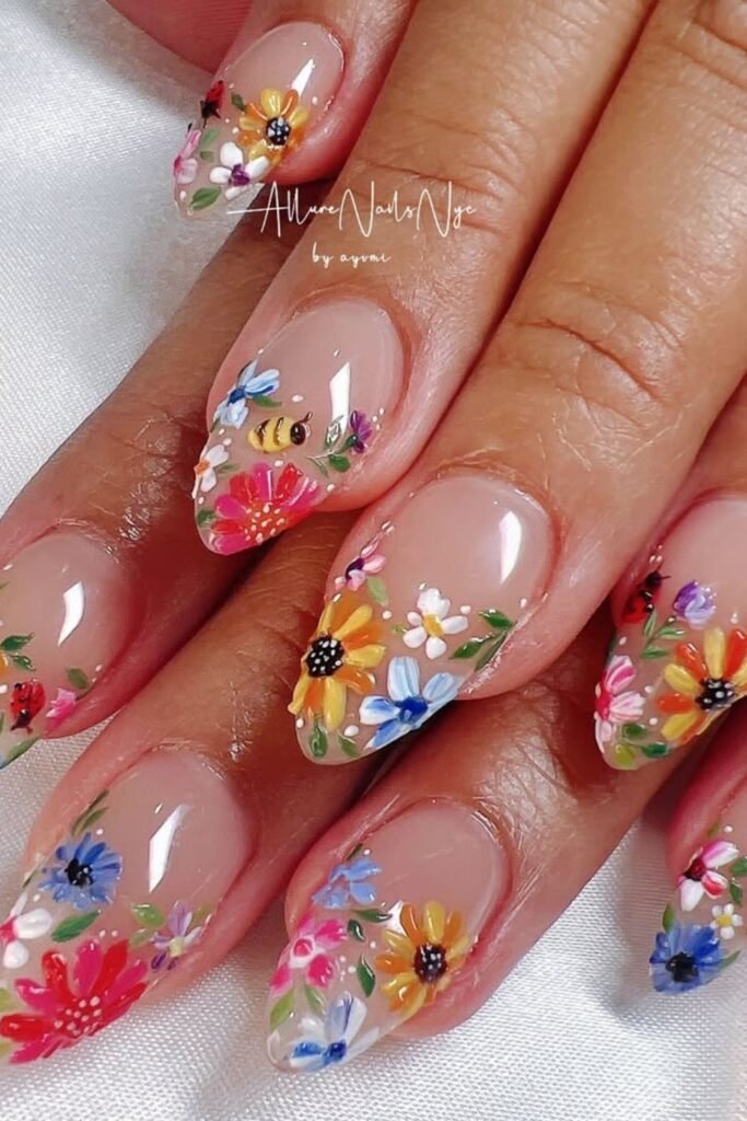 If you love a fresh and playful manicure, colorful sunflower nail ideas are the perfect pick! These sunflower nails bring an effortless glow to your fingertips with soft multi flowers blending beautifully into a subtle ombre effect.