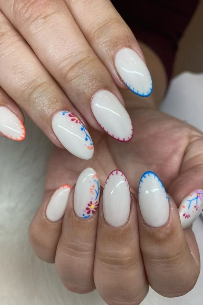 This Cinco de Mayo nail art is a true work of art! The intricate embroidery-inspired patterns in red, blue, and orange give it an authentic Mexican nail design touch, reminiscent of traditional textiles.