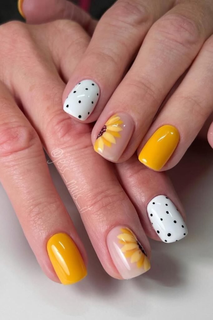 This look is such a fun and bold take on sunflower nails! The mix of simple sunflower nails with the trendy dot pattern makes these perfect for anyone wanting something fresh but not over-the-top. These short sunflower nail designs strike a perfect balance between vibrant and chic.