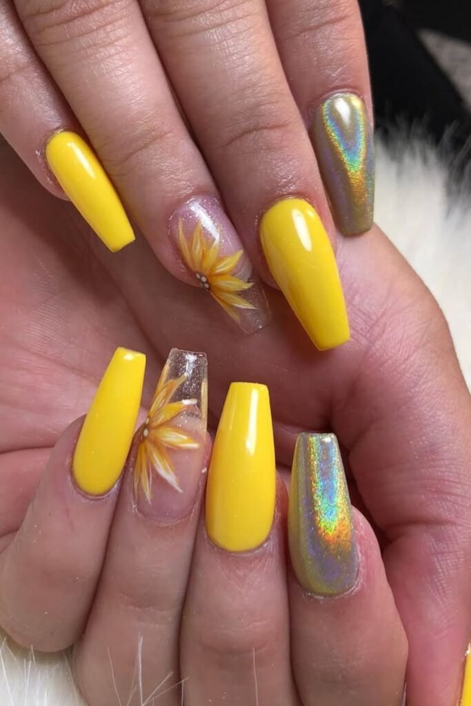 These coffin sunflower nails are absolutely stunning! The combination of rainbow chrome accent and the cute sunflower nails with intricate details, including floral patterns, makes it a gorgeous standout look. If you’re into cute yellow sunflower nails, this style is definitely something to try.