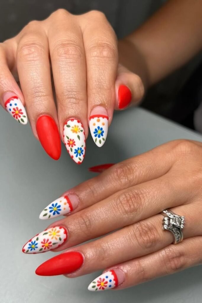 Wow, these Cinco de Mayo nails designs are absolutely stunning! These nails bring out the best of Cinco de Mayo nail art. The deep red base adds a sophisticated flair, while the white tips allow the colorful flowers to shine.