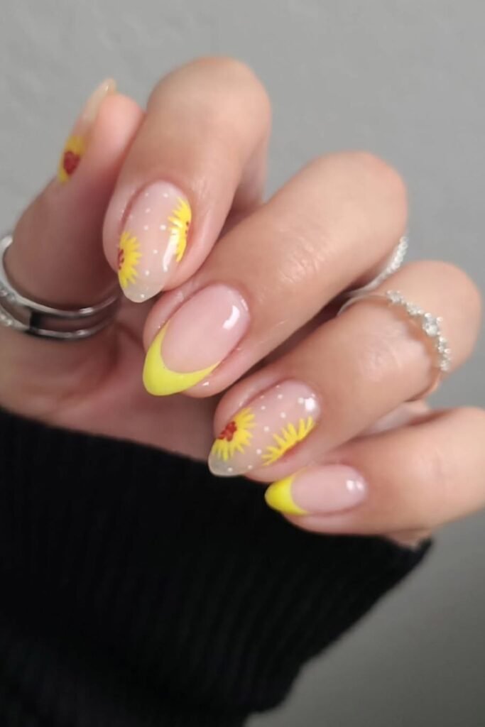This nail design is all about effortless charm! The delicate floral accents give these sunflower nail arts just the right amount of personality without going over the top. Whether you’re into simple sunflower nails for a minimalist look or want to elevate them with extra floral details, these are perfect for any occasion.