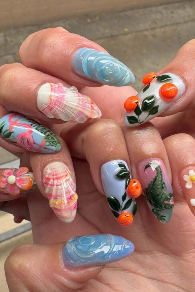 Flamingo-themed tropical nails with green foliage art.