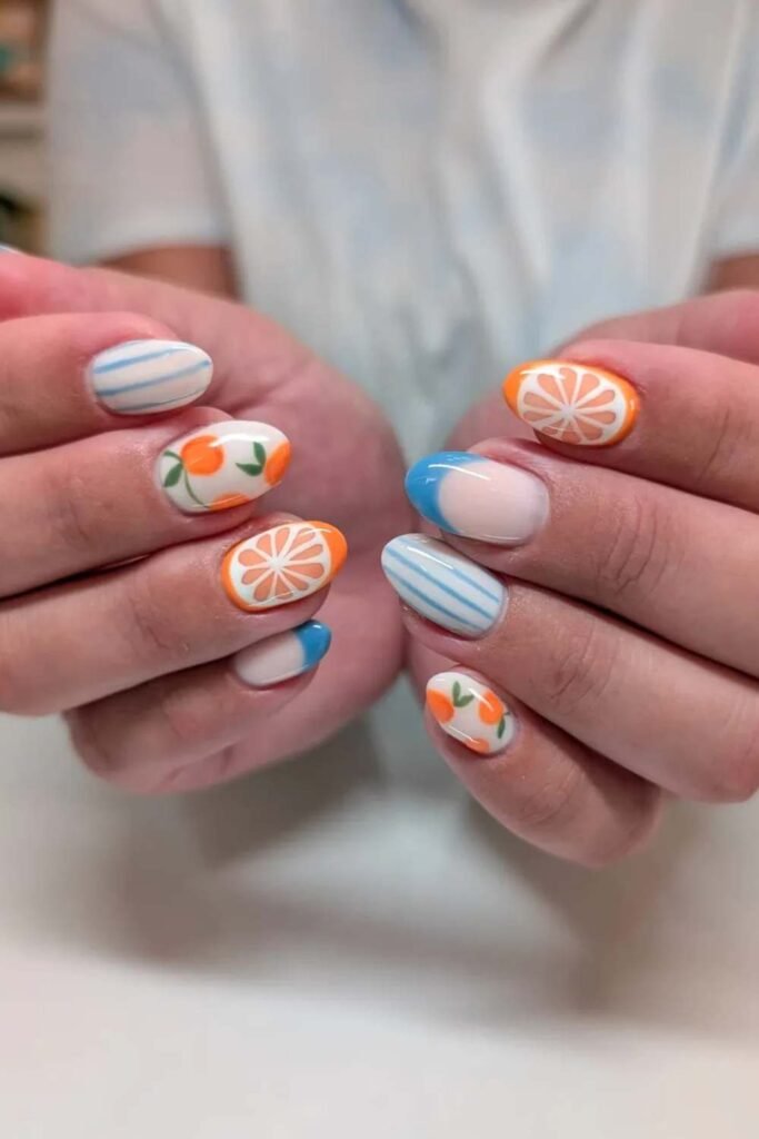 Orange citrus and blue-striped summer nails.
