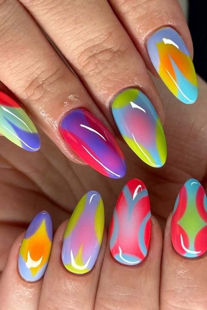 Short summer nails with electric neon swirl art.
