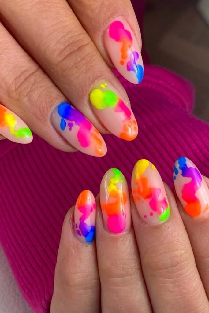 Swirled neon smoke pattern nails for summer.