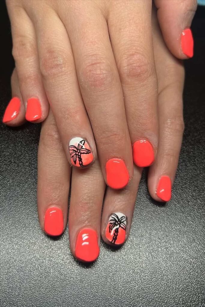 Orange nails with palm tree and branch designs.