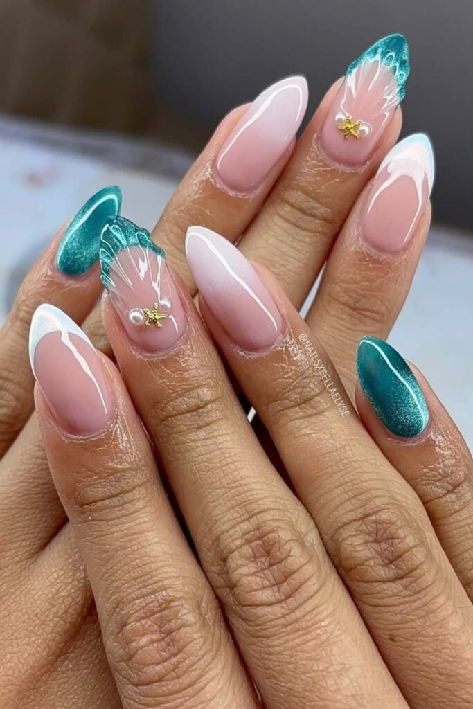 Teal feather and pearl summer nail art on almond nails.