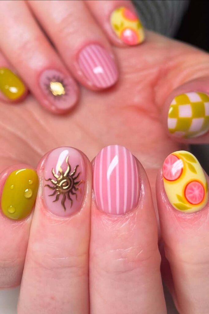 Citrus-themed pink and yellow short summer nails.